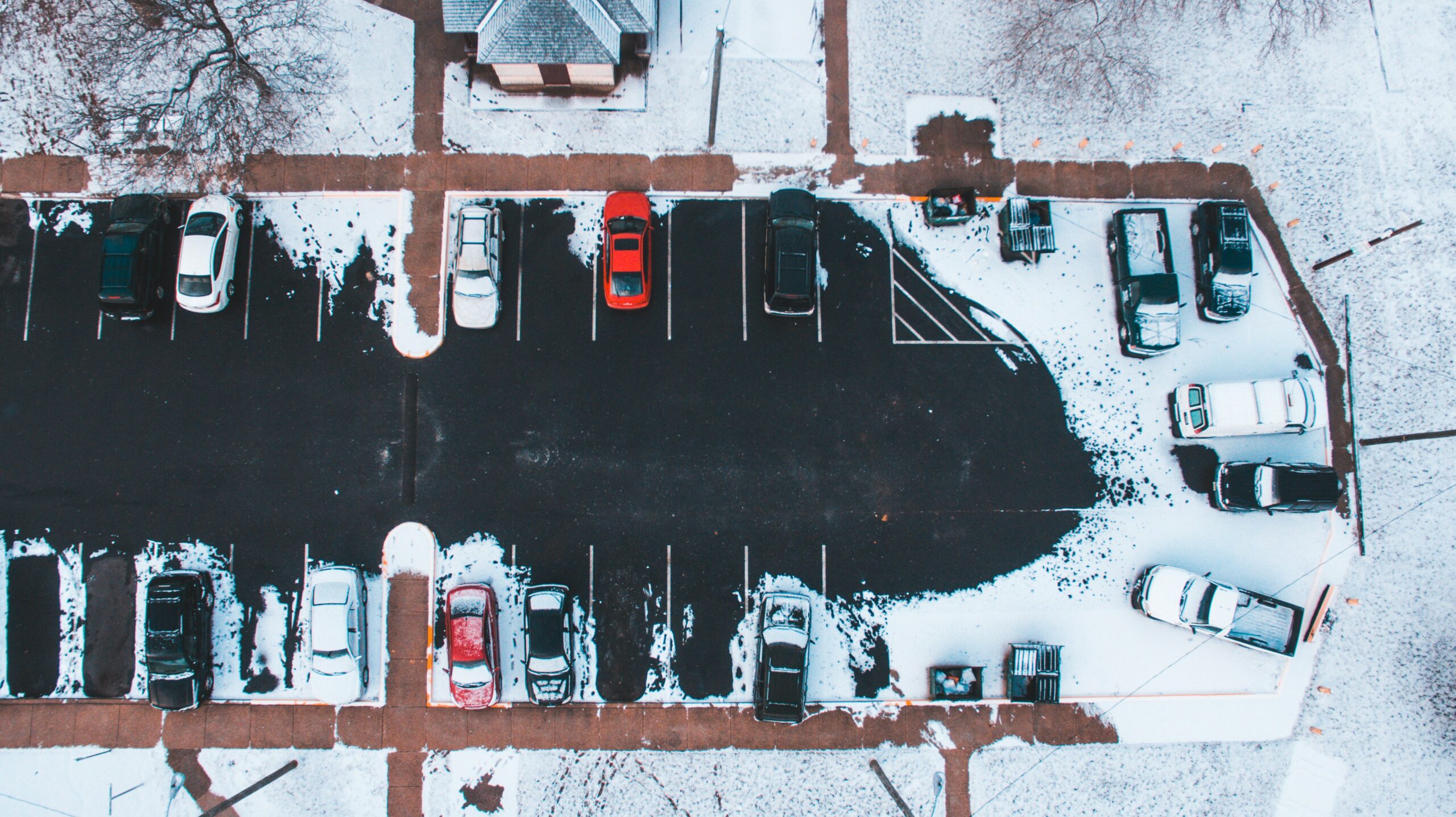 Navigating the Challenges: How Snow Impacts Parking Lots and Solutions